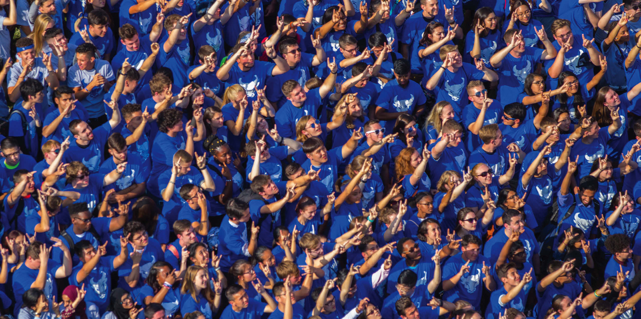 Students show their “horns up” to show their spirit.